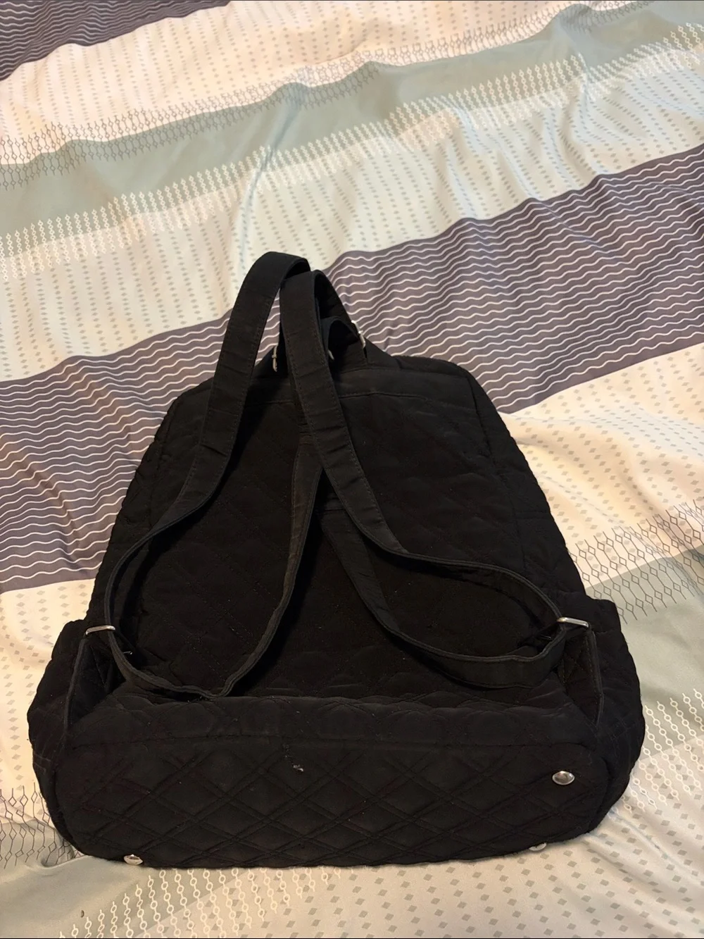 Vera Bradley Black Quilted Backpack with Front Buckle Pockets.